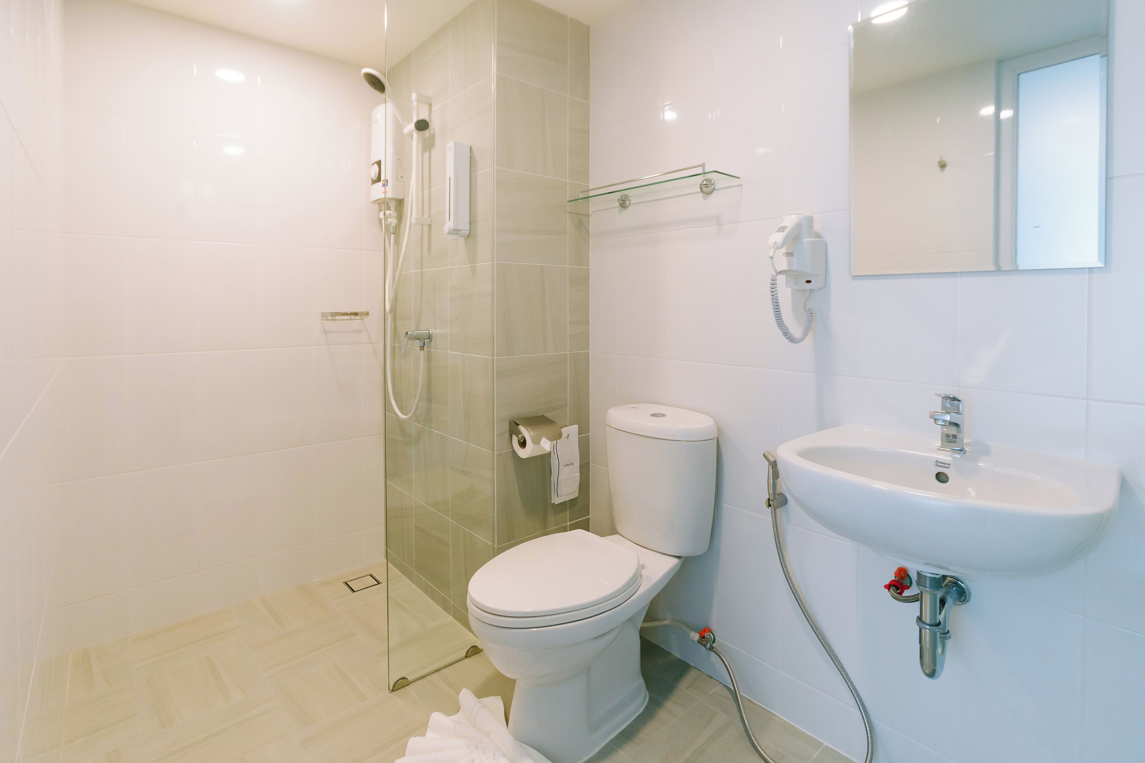 Shower, hair dryer, towels, soap