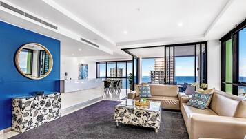 Luxury Apartment, Air conditioning, Ocean View | Living area | Flat-screen TV