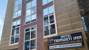 A hotel named "Hotel Trimurtini Inn" with a sign indicating A.C & Non A.C rooms are available. - HOTEL TRIMURTI INN (Lucknow)