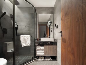 A modern bathroom with a glass shower enclosure, a wooden vanity, and a large mirror. - Jinyun Maixiang Hidden Villa (Lishui)