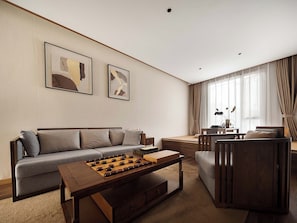Executive Suite, Partial Lake View | Living room | TV