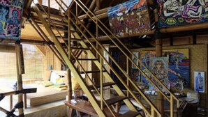 A bamboo staircase with colorful murals on the walls. - The Studio at Warung Bambu Pemaron (Buleleng)
