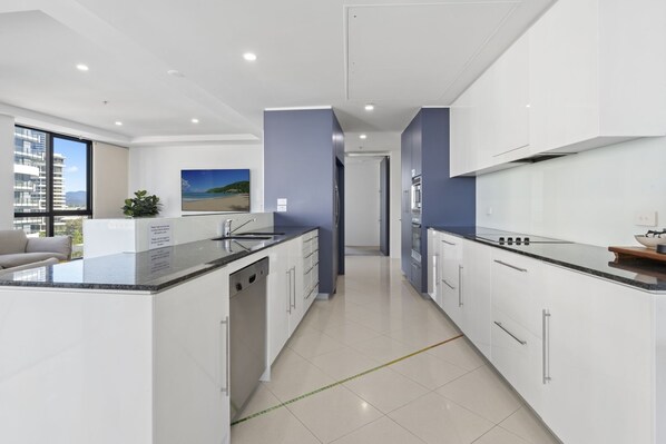 Deluxe Apartment, Ocean View, Beachside | Private kitchen | Highchair