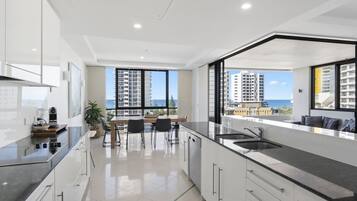 Deluxe Apartment, Ocean View, Beachside | Private kitchen | Highchair