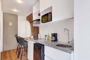 Fridge, microwave, stovetop, coffee/tea maker