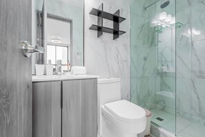 Shower, hair dryer, towels