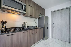 Fridge, microwave, stovetop, coffee/tea maker