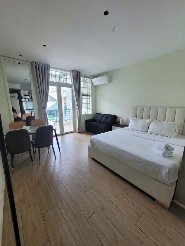 Deluxe Studio, Balcony, City View | Desk, laptop workspace, free WiFi