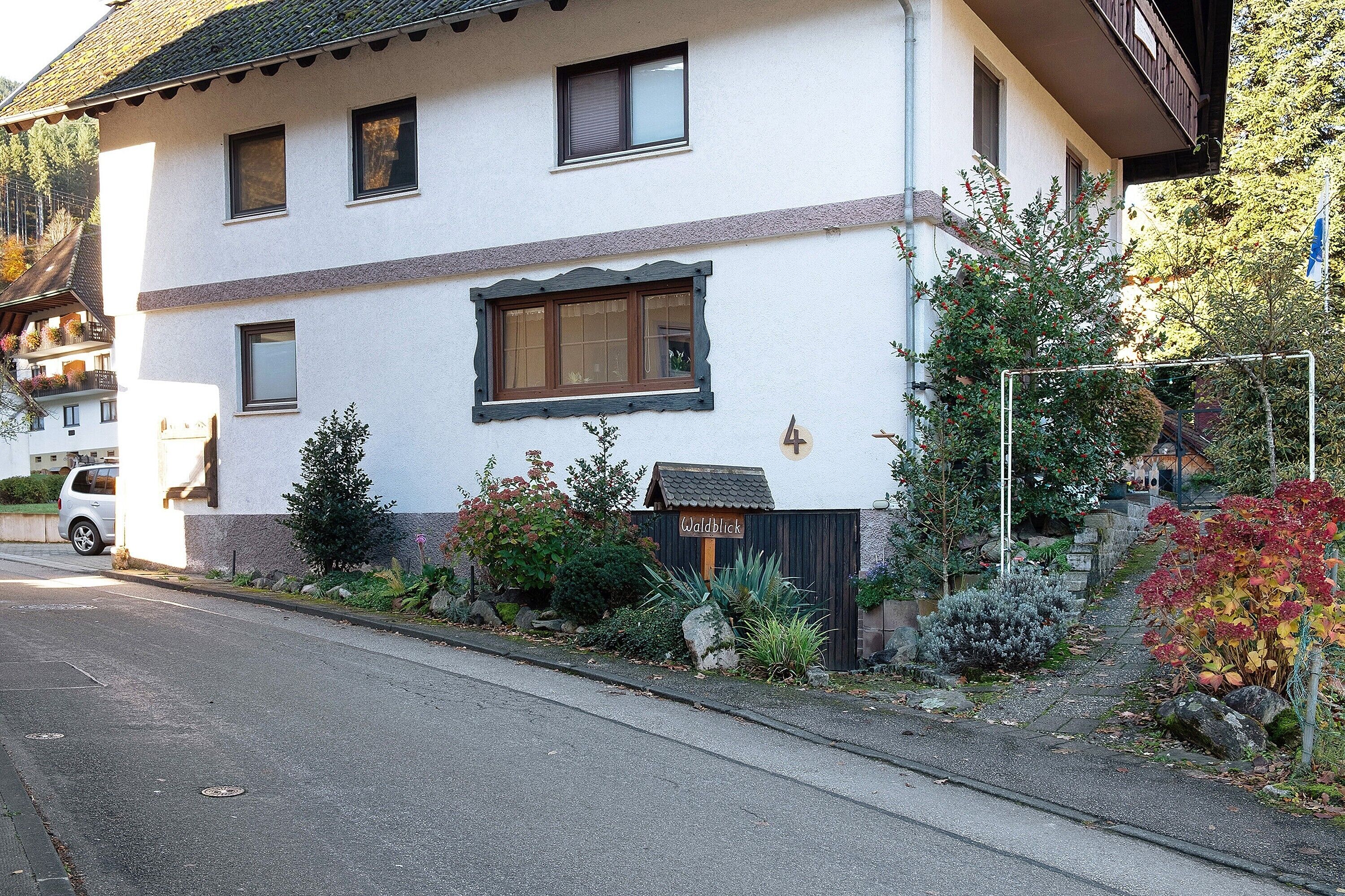 A two-story building with a sign reading 'Waldblick.'