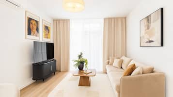 Deluxe Apartment, 1 Bedroom, City View | Living room | 55-cm LED TV with digital channels