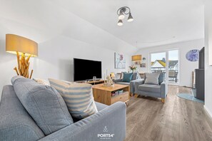 TV, fireplace, books, stereo