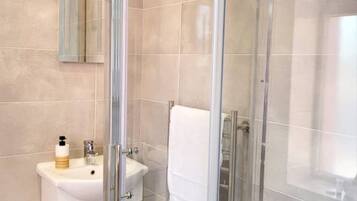 Shower, hair dryer, towels, soap