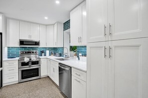Coffee/tea maker, fridge, microwave, oven
