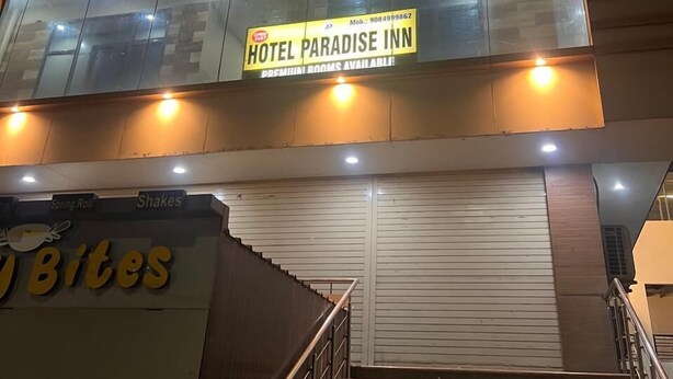 A hotel named 'Paradise Inn' with a sign indicating premium rooms available. - Paradise Inn (Dehradun)