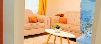 Cosy Homes Eldoret. Queen bed overlooking downtown.