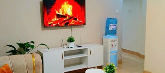 Cosy Homes Eldoret. Queen bed overlooking downtown.