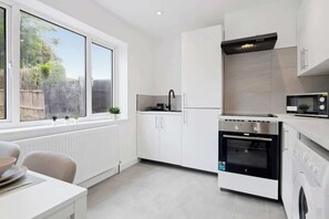 Fridge, stovetop, cookware/dishes/utensils