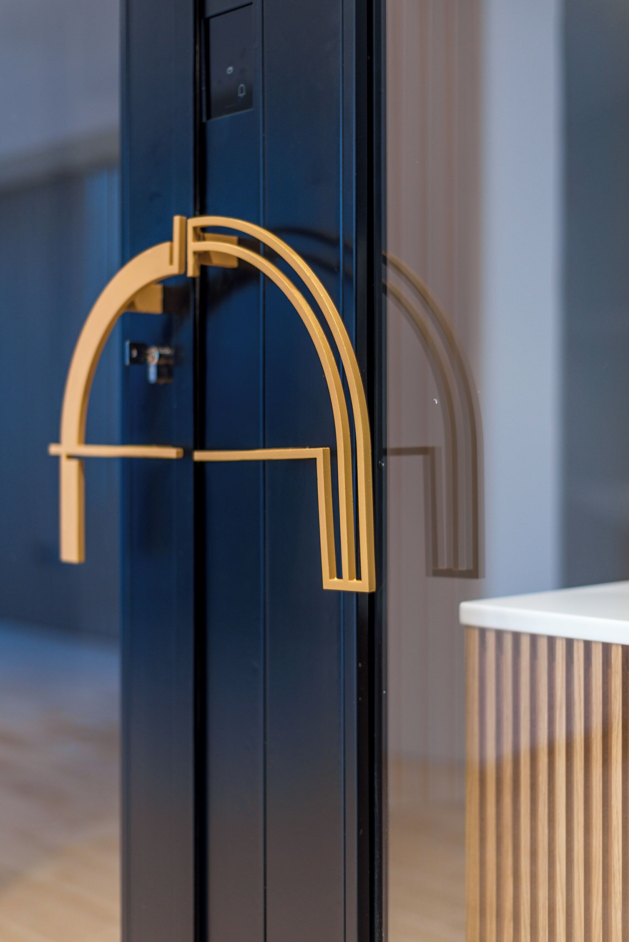 A door with a modern, geometric handle design.