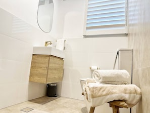 Shower, hair dryer, towels, soap