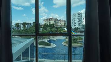 Luxury Condo, 1 Queen Bed with Sofa bed, Balcony, Pool View