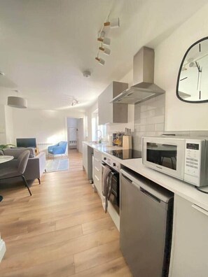 Fridge, microwave, oven, cookware/dishes/utensils
