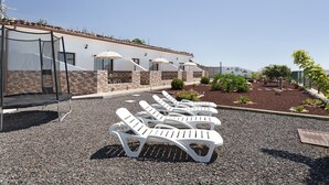 A building with outdoor seating and a covered area.