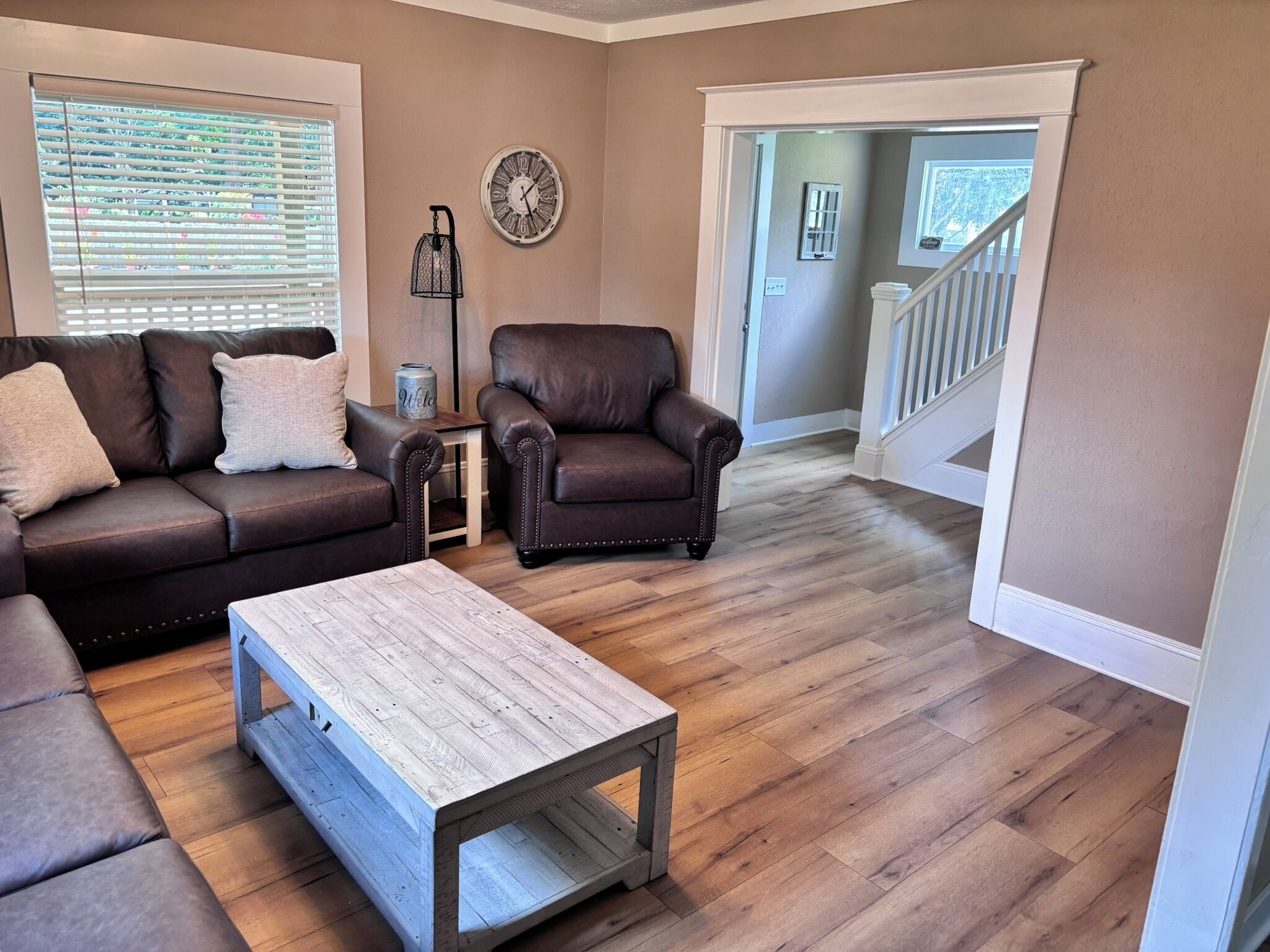 Family room, to the right of the front door.  Large couch is a sofa-bed