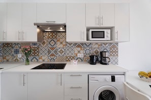 Fridge, microwave, stovetop, coffee/tea maker