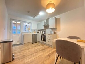 Fridge, microwave, oven, cookware/dishes/utensils