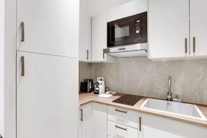 Fridge, microwave, stovetop, coffee/tea maker