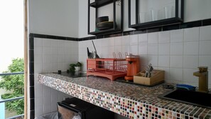 Microwave, dishwasher, coffee/tea maker, cookware/dishes/utensils
