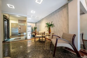 A lobby with a marble floor, seating area, and a reception desk. - Sea View Apartm. 130m From the Beach in BC Esa901 (Balneário Camboriú)