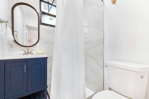 Shower, eco-friendly toiletries, hair dryer, towels