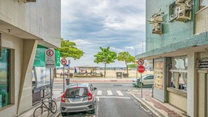 A street view with a parked car, a bicycle, and a pedestrian crossing. - 3 Bedroom apt 100m fr/ the Central Beach BC Edg401 (Balneário Camboriú)