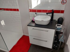 Shower, hair dryer, towels, toilet paper