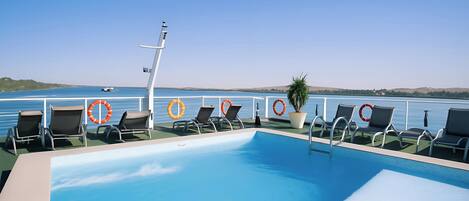 Outdoor pool, pool umbrellas, sun loungers