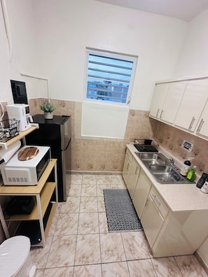 Fridge, microwave, coffee/tea maker, toaster
