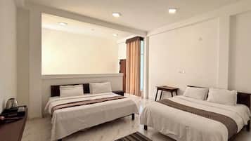 Family Room | Minibar, desk, free WiFi, bed sheets
