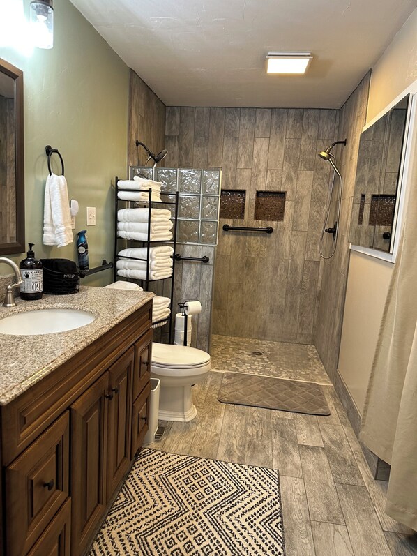 Shower, hair dryer, towels, soap