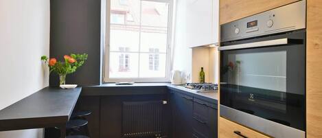 Fridge, coffee/tea maker, high chair, cookware/dishes/utensils