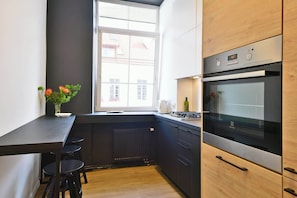 Fridge, coffee/tea maker, highchair, cookware/dishes/utensils