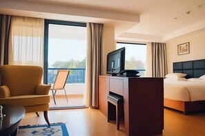 Deluxe Suite, Balcony, River View | In-room safe, laptop workspace