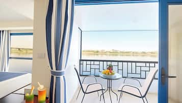 Deluxe Suite, Balcony, River View | In-room safe, laptop workspace