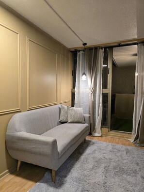 Apartment, 1 Doppelbett und Schlafsofa, Gartenblick | Wohnbereich