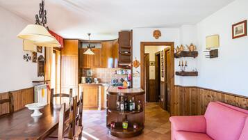 Apartment (2 Bedrooms) | Living area | 32-inch Smart TV with cable channels