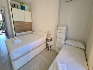 Departamento | 2 habitaciones y tabla de planchar con plancha 