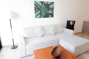 Apartamento conforto | Sala de estar | Smart TV 50 polegadas com canais digitais