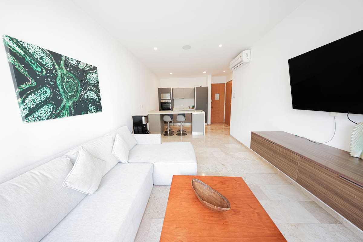 Comfort Apartment | Living area | 50-inch Smart TV with digital channels