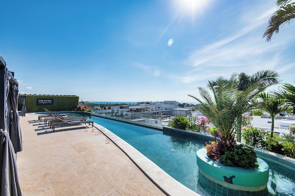 Outdoor pool, open 8:30 AM to 10:00 PM, pool loungers