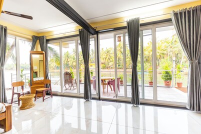 Riverside Retreat HomeStay – AC Studio with Breakfast Option & Boat Ride